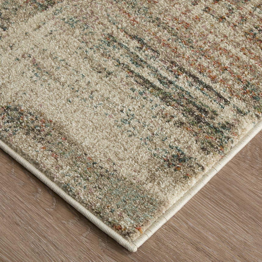Close up of Feizy Eden Ivory/Gray/Green Area Rug showing abstract pattern and textured weave. Corner