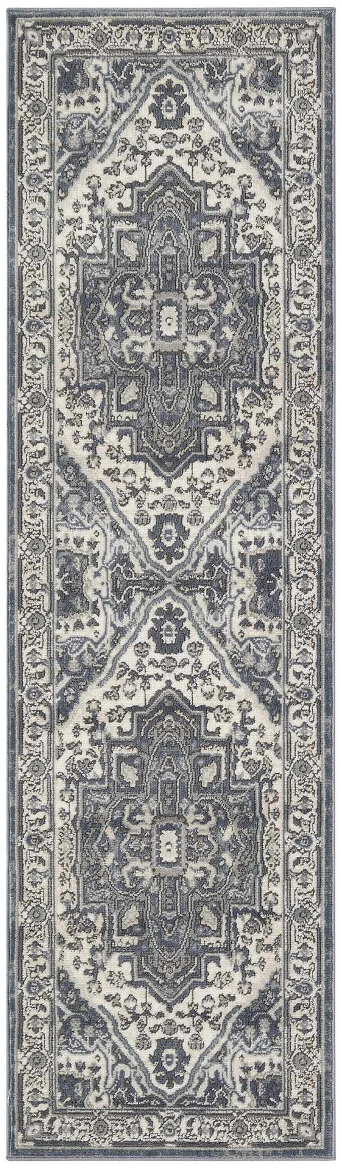 Close-up of Nourison Quarry Navy Ivory Vintage Area Rug. Features a detailed, traditional floral and geometric pattern.