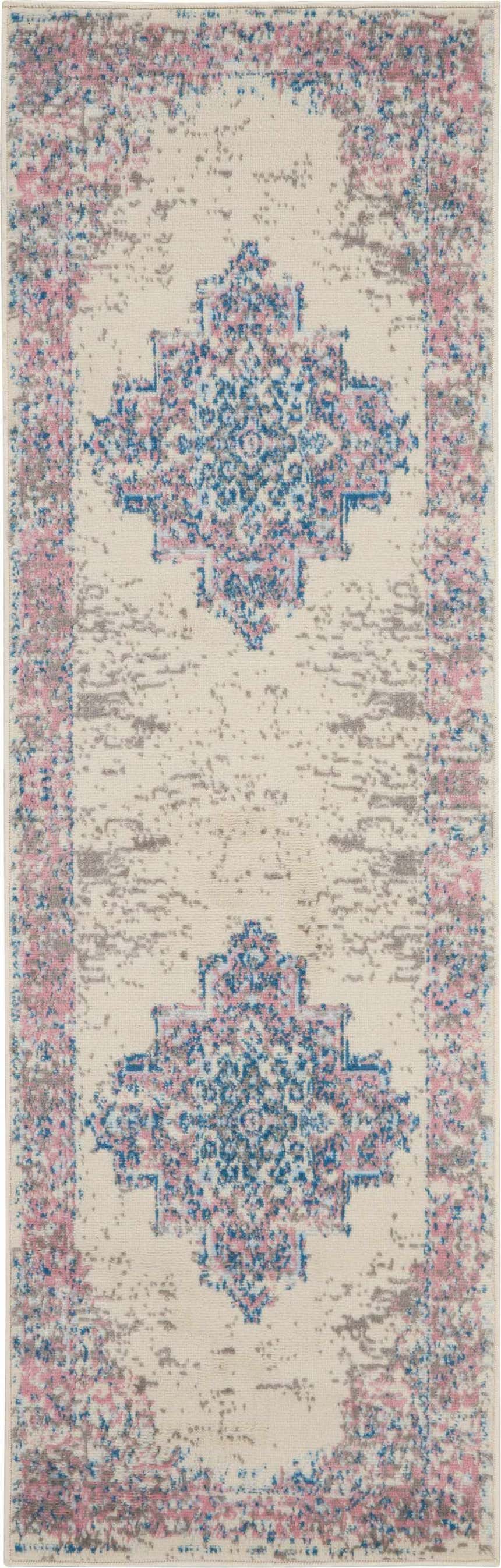 Close-up of Nourison Grafix Ivory Pink Vintage Area Rug. Features a distressed floral pattern in ivory, pink, blue, and gray.