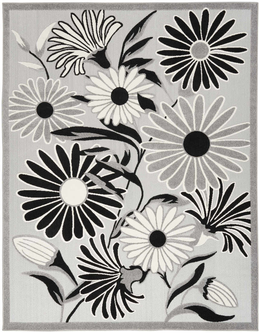 Close-up of the Nourison Aloha Black White Outdoor Area Rug featuring a floral design in black, white, and gray.