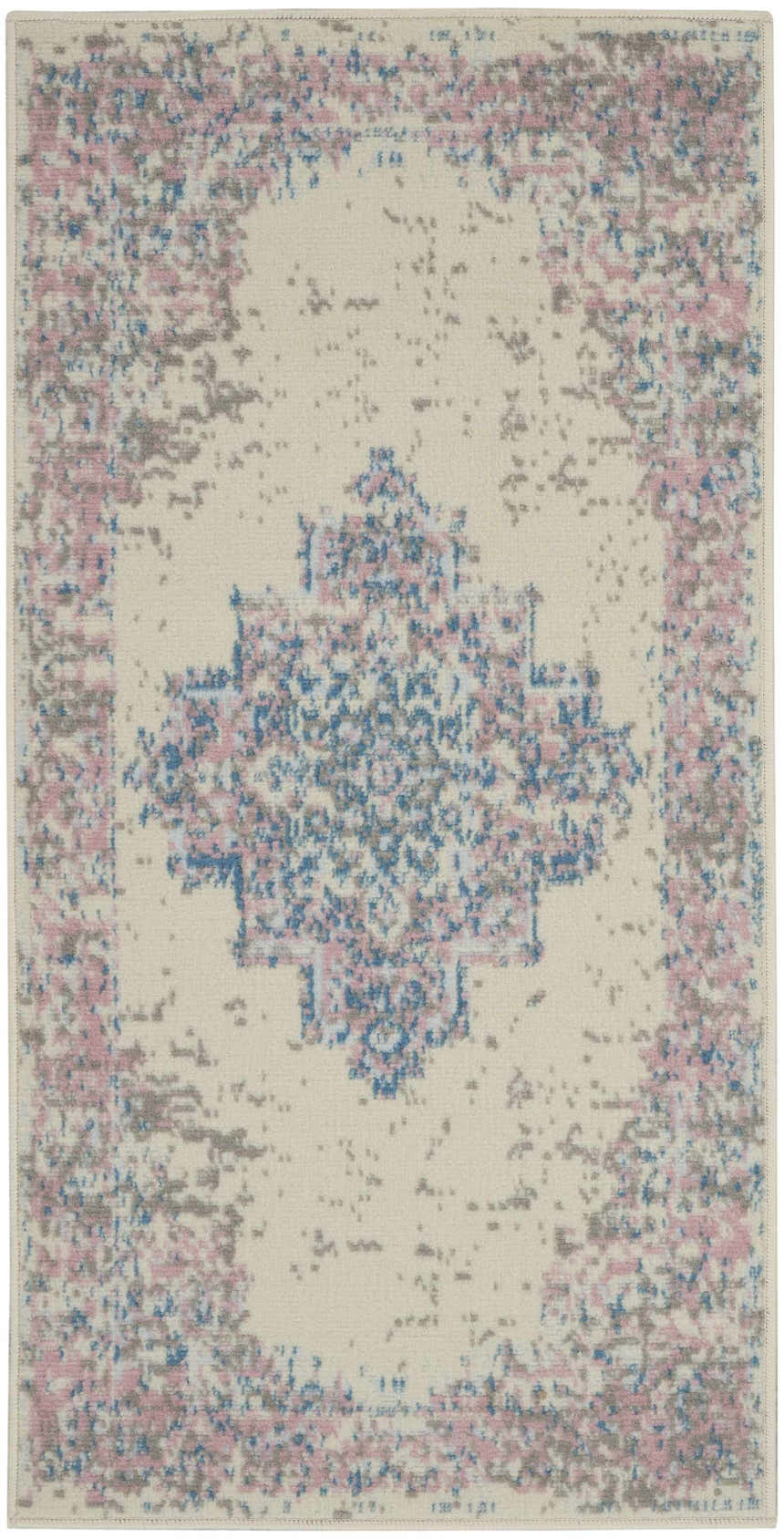 Close-up of the Nourison Grafix Ivory Pink Vintage Indoor Area Rug with a distressed floral medallion pattern.