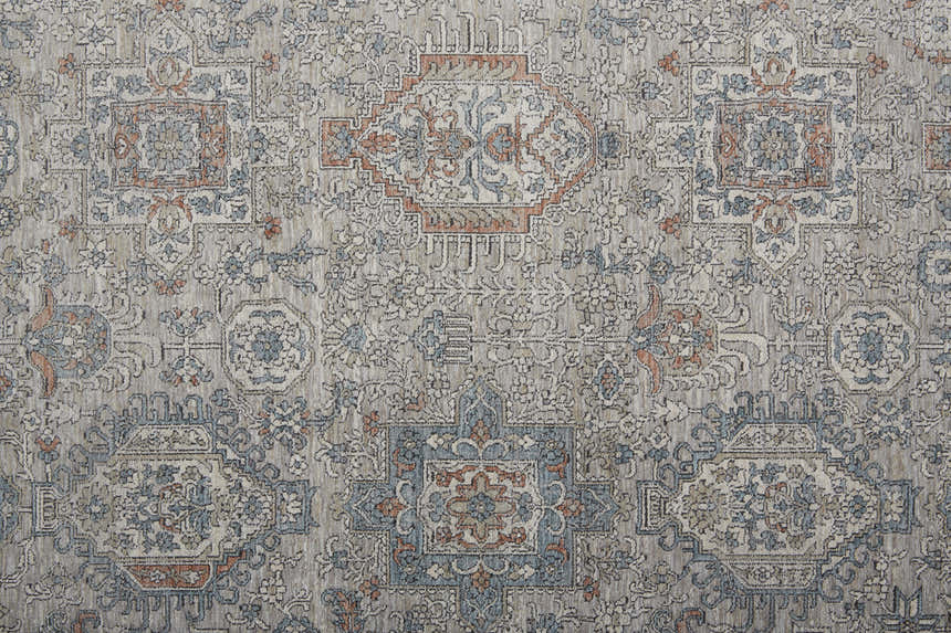 Close-up of the Feizy Marquette Taupe/Silver/Blue Area Rug. Features a transitional oriental pattern and soft, muted colors. Texture