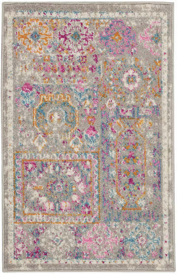 Close-up of Nourison Passion Grey Multicolor Bohemian Area Rug, featuring a distressed gray, pink, blue, and orange pattern.