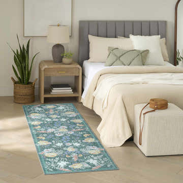 Farmhouse bedroom scene with the Nourison Botanical Green Multicolor area rug. Floral rug adds color to neutral room.