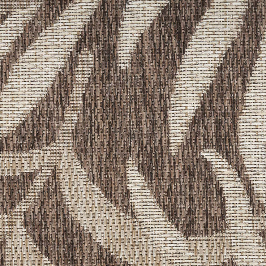 Close-up of the Nourison Garden Oasis Mocha Tropical Area Rug, showing light brown woven texture and geometric pattern.