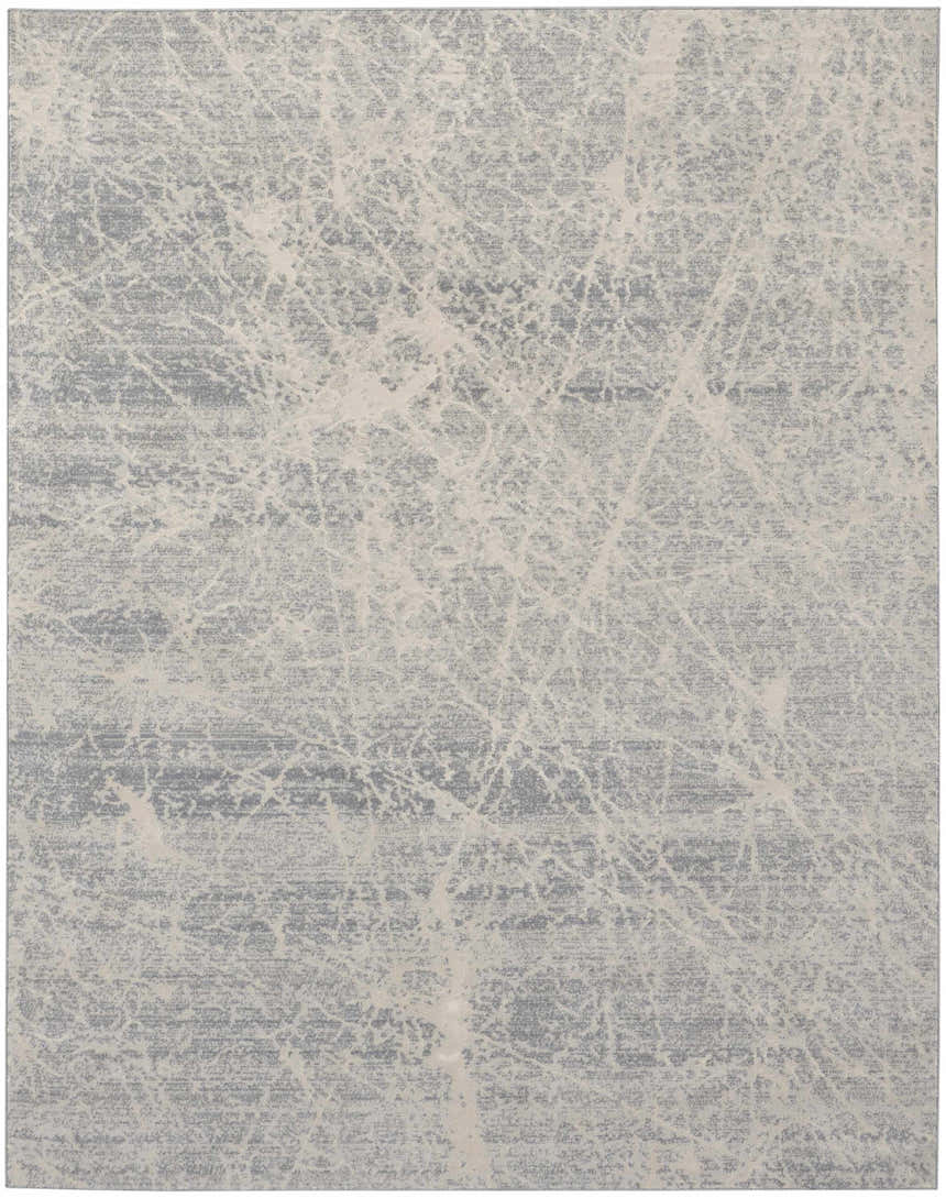 Close-up of the Nourison Exhale Ivory Grey rug, featuring a high pile and modern abstract pattern.