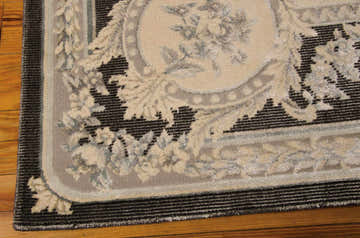 Close up of the Michael Amini Platine Charcoal rug showing vintage floral design, taupe, and charcoal colors.