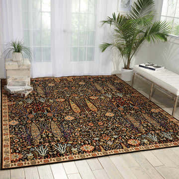 Bright room with Nourison Timeless Navy rug, white bench, and plants. Traditional style with floral and paisley patterns.