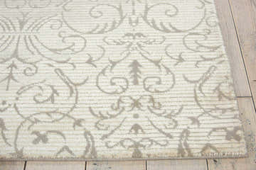Close up of the Nourison Luminance Opal Vintage rug, showcasing its soft opal color and intricate vintage pattern.