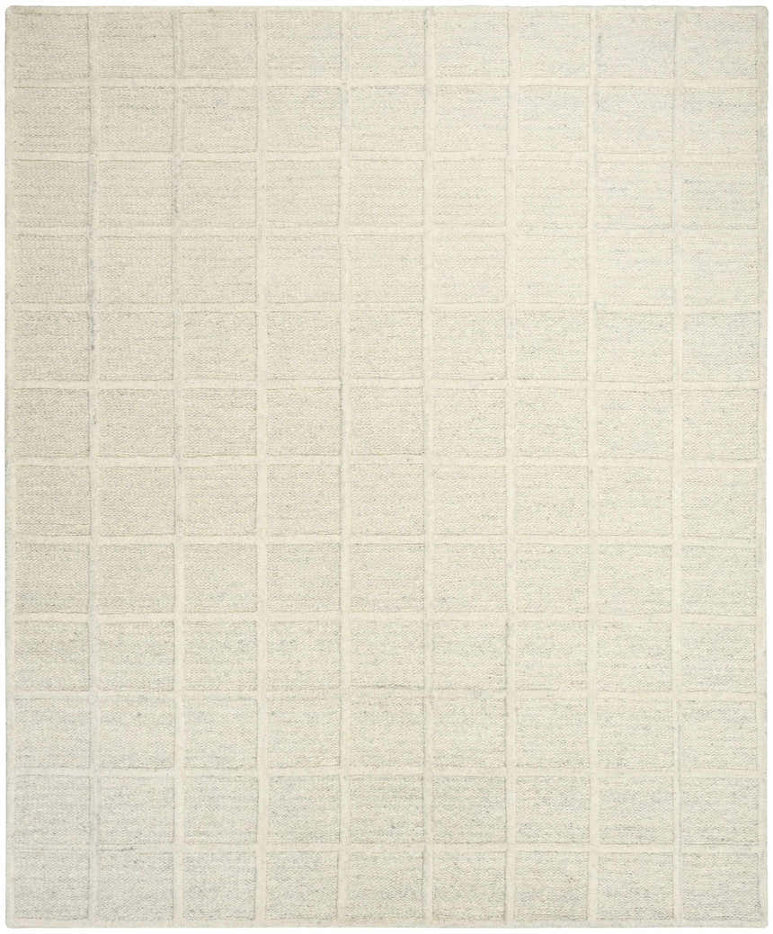 Close-up of the DKNY Pure Framework Ivory rug featuring a raised square grid pattern and textured wool.