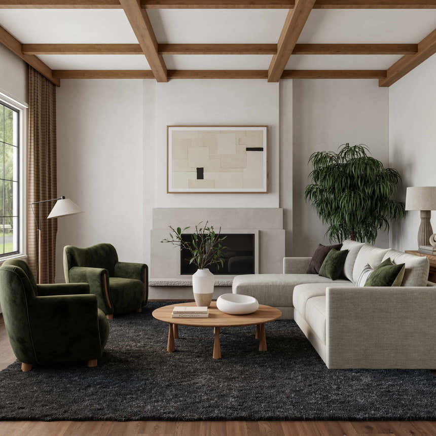 Living room scene with a Nourison Dreamy Shag grey rug, sofa, green chairs, fireplace, and wood accents.