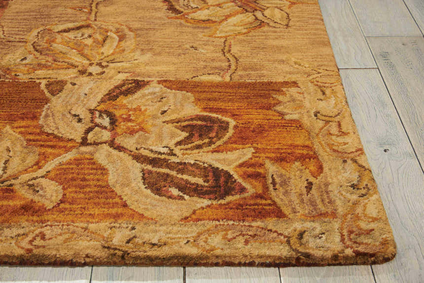 Close-up of the handmade Nourison Jaipur Multicolor Persian rug. Wool and cotton rug features a floral design in warm, earthy tones.