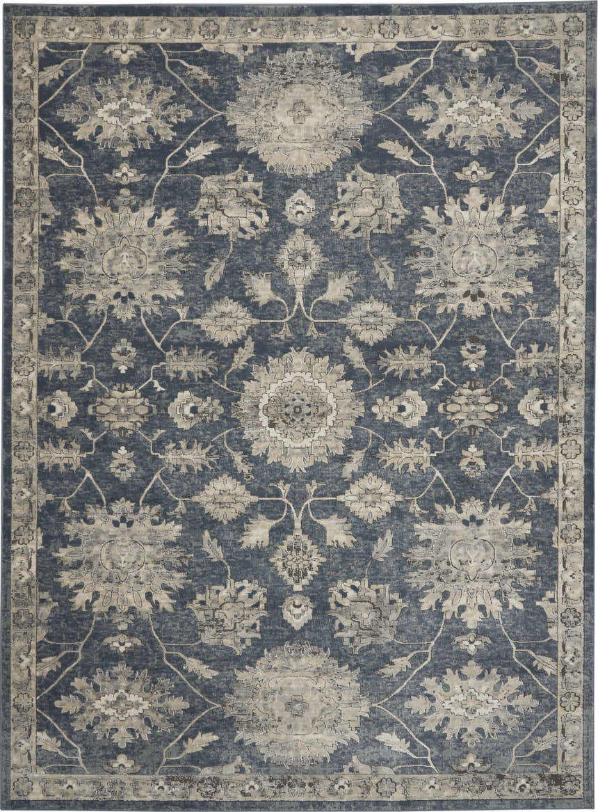 Close-up of the Nourison Quarry Blue Beige Vintage Area Rug, featuring a floral pattern and vintage style.
