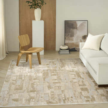Living room scene with a beige sofa and the Calvin Klein CK089 Drift Beige Grey rug adding a modern touch.