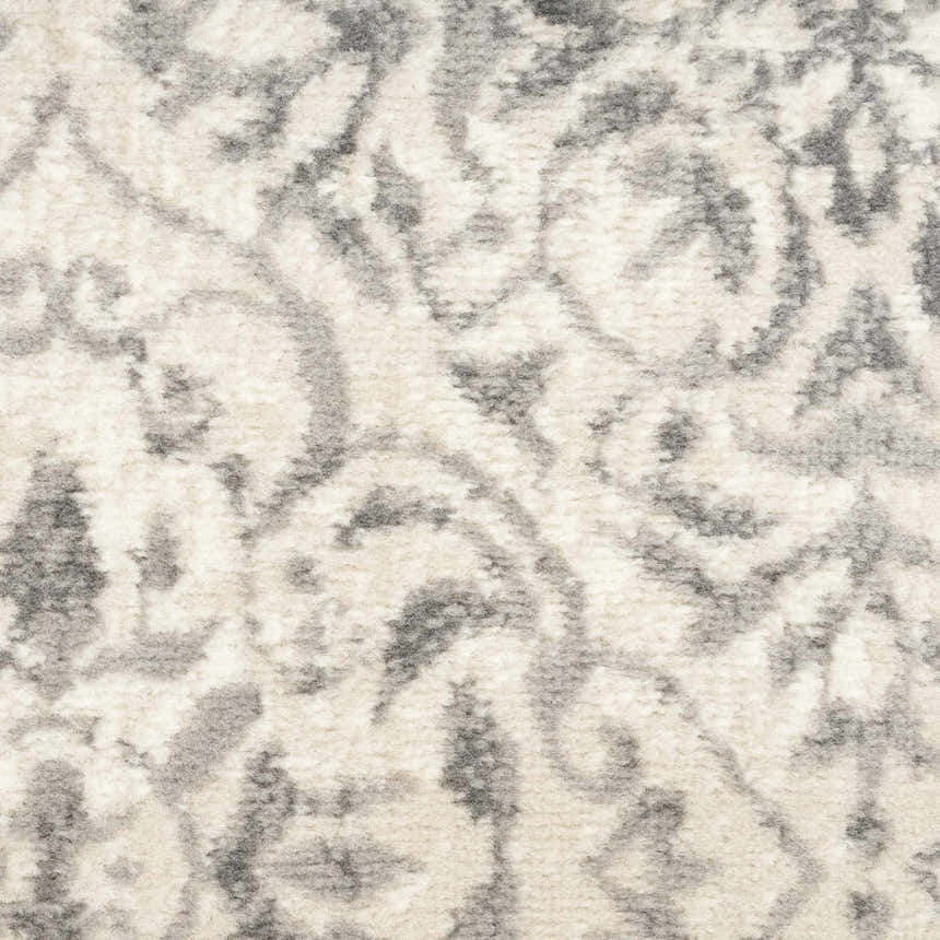 Close-up of the Nourison Jubilant Ivory Grey Vintage rug, showcasing its soft texture and chestnut-toned abstract pattern.