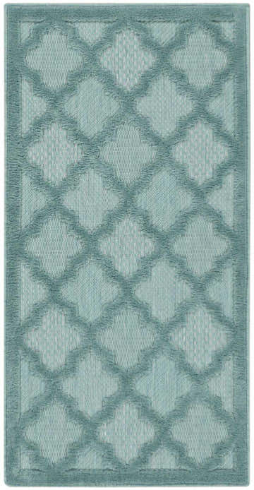Close-up of the Nourison Easy Care Aqua Teal Modern Area Rug, featuring a quatrefoil pattern and soft aqua hues.
