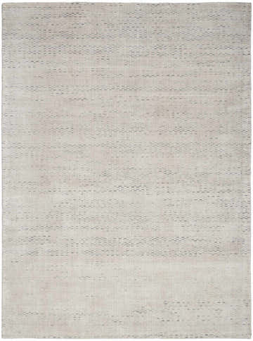 Close-up of the handmade Calvin Klein Valley Silver rug. Features a subtle gray, mid-century modern design.