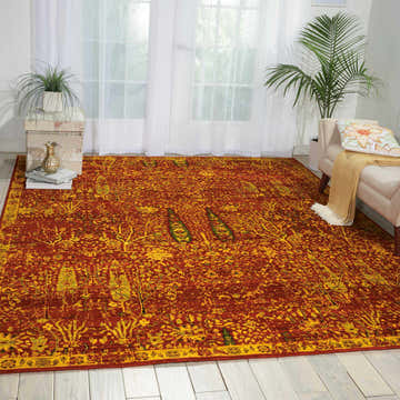 Bright living room with a Nourison Timeless Scarlet Persian rug, daybed, and white wood floors.