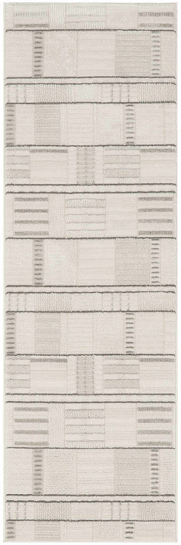 Close-up of the Nourison Nordic Ivory Grey rug, featuring a modern geometric pattern and subtle chestnut accents.