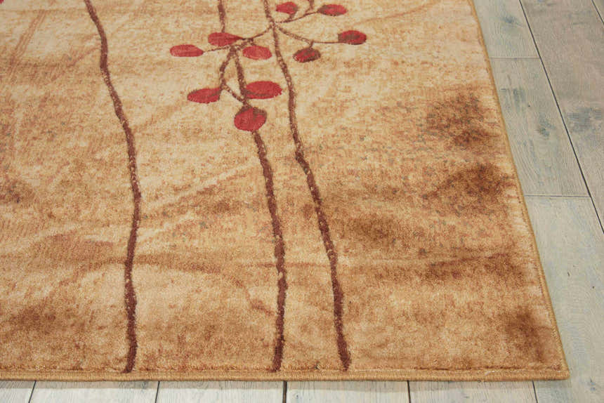 Close-up of a Nourison Somerset Latte rug showing its Southwestern style, latte color, and red floral accents.