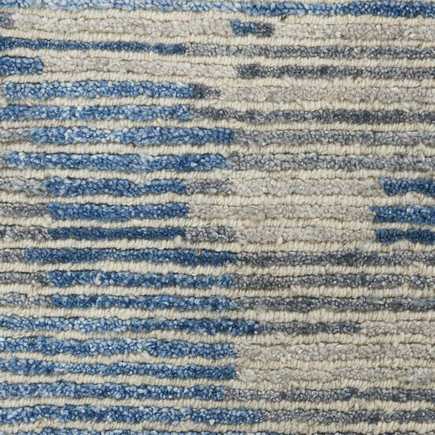 Close up of the textured, striped design of the Nourison Ellora Blue area rug.