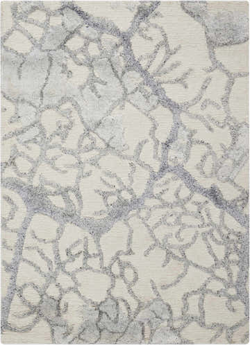 Close-up of the Nourison Divine Ivory rug. Abstract chestnut pattern on a textured, handmade, mid-century modern rug.