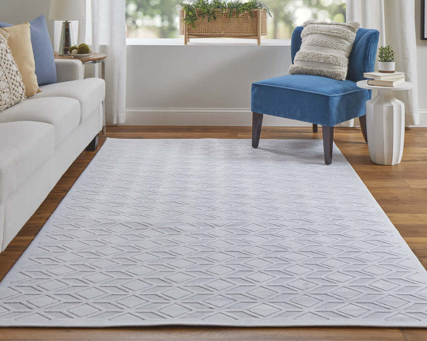 Living room scene with white sofa and Feizy Saphir Mira white rug featuring a geometric criss-cross pattern. Roomscene-Rectangle