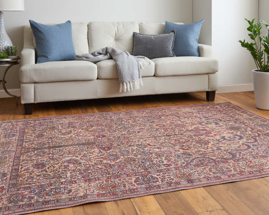 Living room scene with a Feizy Rawlins Red/Tan/Pink rug, cream sofa, blue pillows, and wood floors. Roomscene-Rectangle