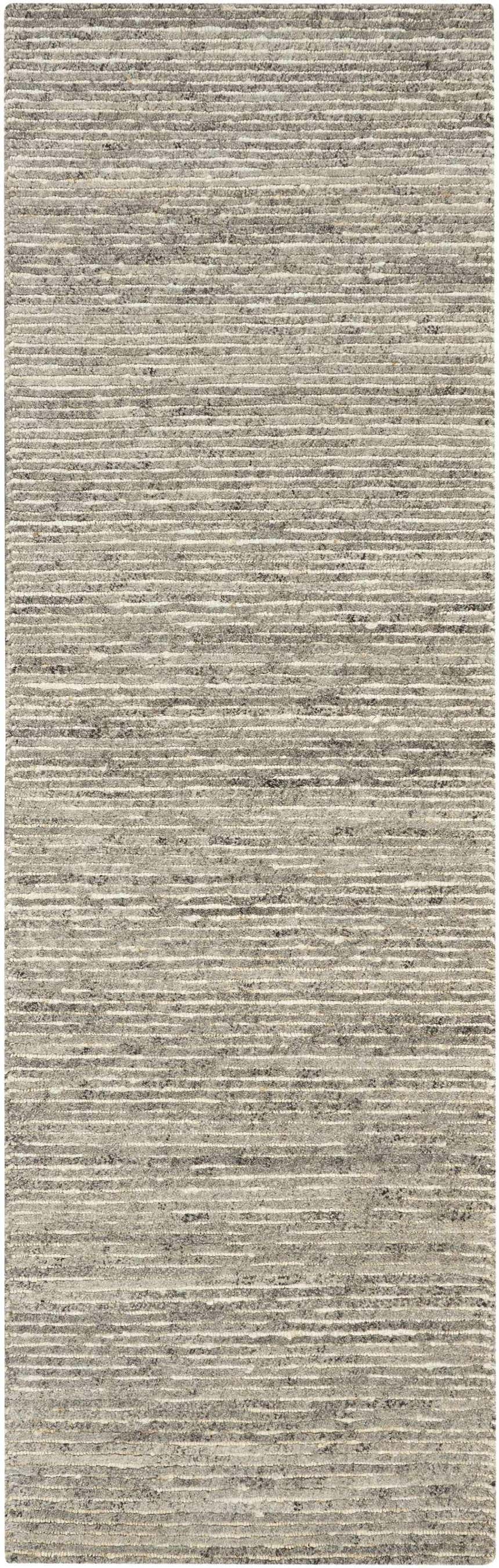 Close-up of the Calvin Klein Kathmandu Grey rug. Mid-century modern style with horizontal stripes and wool jute texture.
