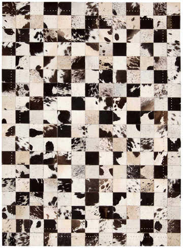 Close-up of the Barclay Butera Medley Tuxedo rug. Black and white hair on hide squares create a modern, checkered pattern.