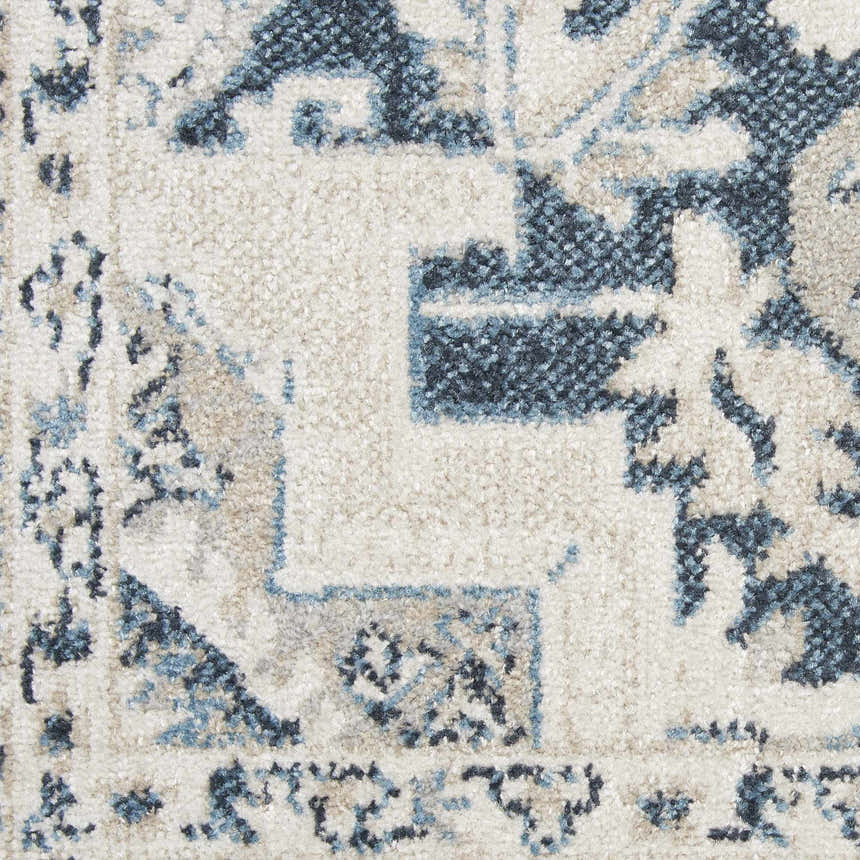 Close-up of the Nourison Carina Blue Grey Vintage Indoor Area Rug showing its detailed vintage pattern and soft texture.