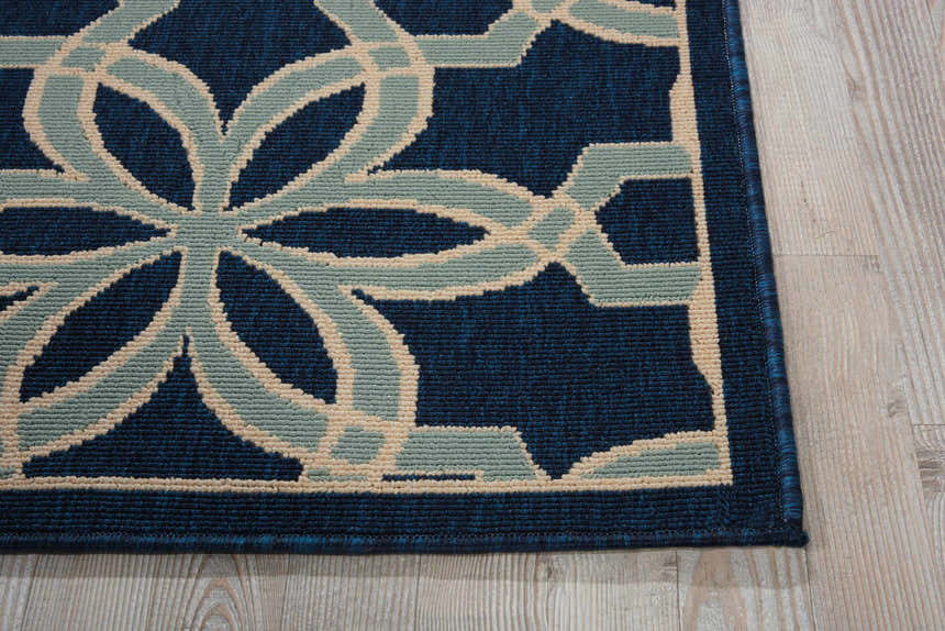 Close-up of the Nourison Caribbean Navy Contemporary Area Rug showing the floral pattern and texture.