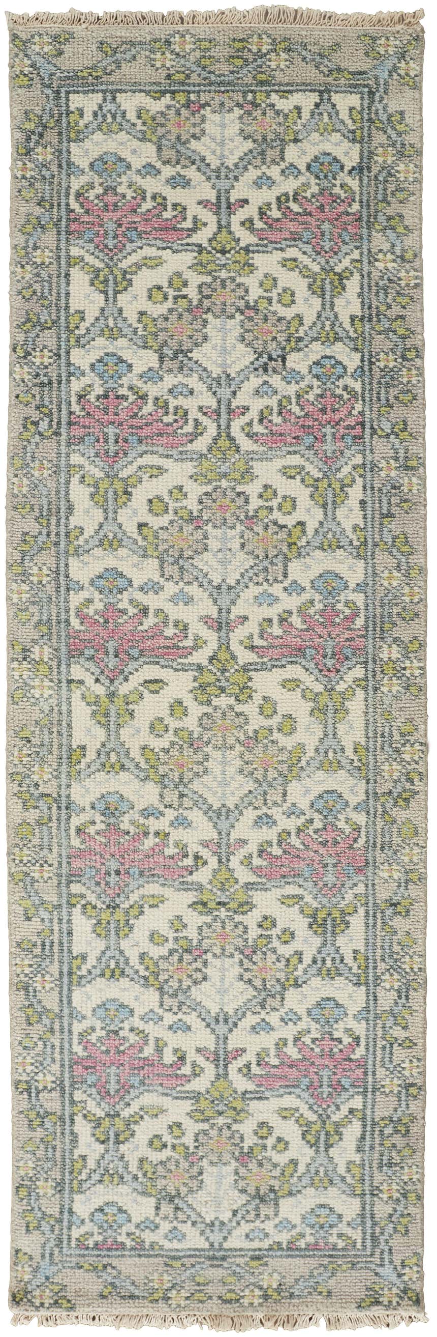 Close-up of the Feizy Beall rug. Ivory rug with pink, green, and blue floral and botanical pattern. Hand-knotted wool runner. Design-Runner