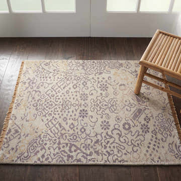 Close-up of the Nourison Aldora Opal Vintage rug, showcasing its delicate floral pattern and subtle opal hues.