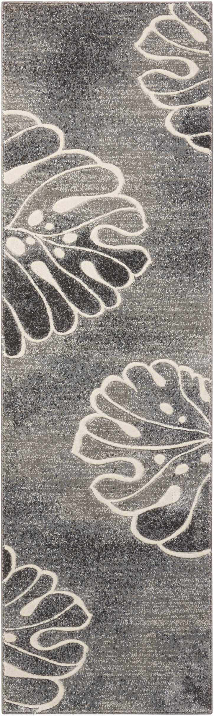 Close-up of the Nourison Maxell Grey rug. Modern runner rug with a gray background and large white floral pattern.