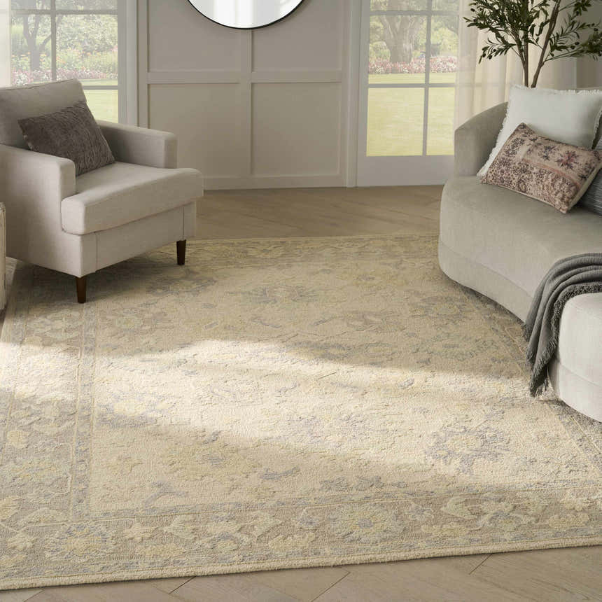 Living room with ivory chairs and Nourison Maison Ivory Taupe Vintage Area Rug.