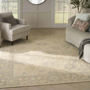 Living room with ivory chairs and Nourison Maison Ivory Taupe Vintage Area Rug.