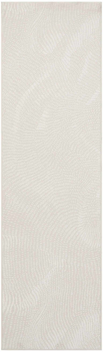 Close up of the DKNY Central Park West Ivory rug showing a textured, abstract pattern.