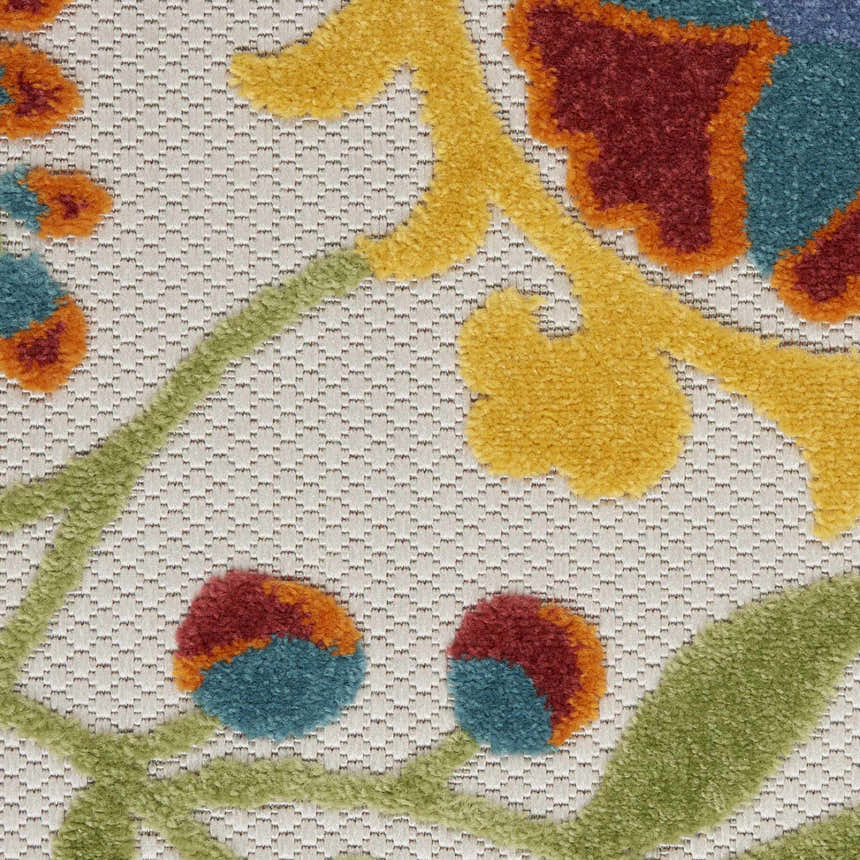Close up of Nourison Aloha Ivory Multicolor rug showing floral pattern, chestnut, yellow, green, and teal colors.