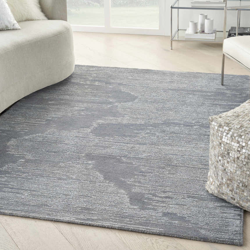 Modern living room with light wood floors and the Michael Amini Ma30 Star Blue rug.