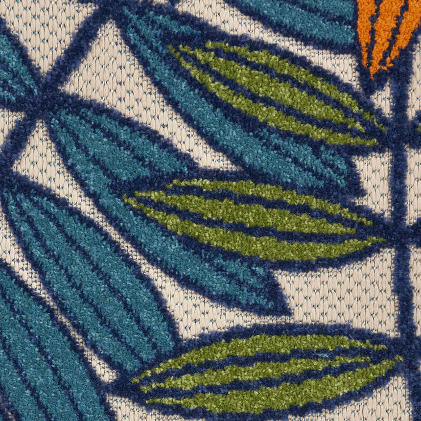 Close-up of Nourison Aloha Multicolor Tropical Area Rug featuring a leaf pattern in blue, green, and orange.