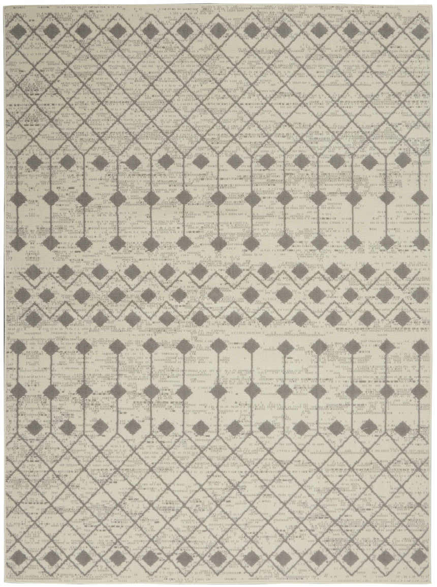 Close-up of the Nourison Grafix Ivory/Grey rug, showcasing its geometric diamond pattern and subtle bohemian design.