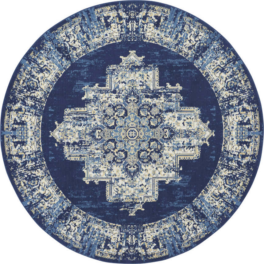 Round Nourison Grafix Navy Blue Vintage Area Rug with a distressed, ornate medallion pattern in navy, blue, and cream.