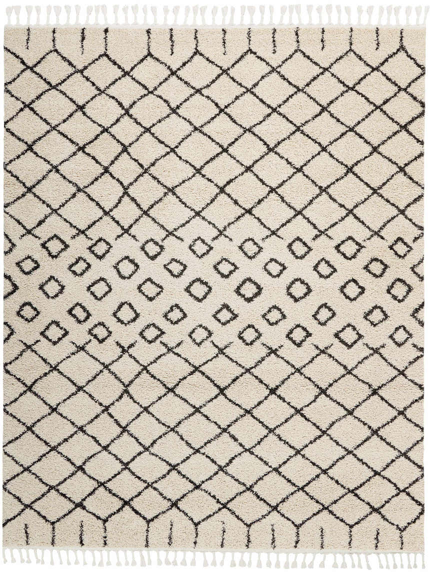 Close-up of a Nourison Moroccan Shag Cream Tribal Indoor Area Rug with a diamond pattern and white fringe.