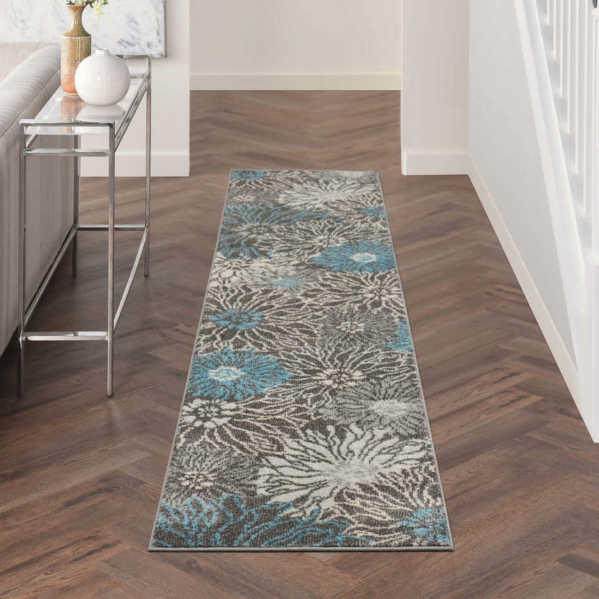 Hallway scene with Nourison Passion Charcoal Blue runner rug. Floral pattern in taupe, blue, and white on dark wood floor.