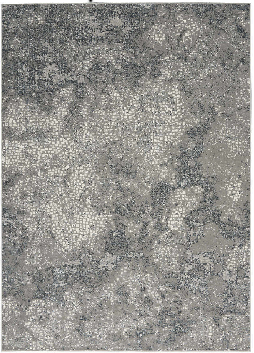 Close-up of the Michael Amini MA90 Uptown Grey rug. Modern design with gray, white, and dark gray abstract pattern.