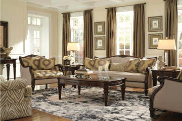 Elegant living room with a Michael Amini Gleam Flint rug, sofa, chairs, and dark wood coffee table.