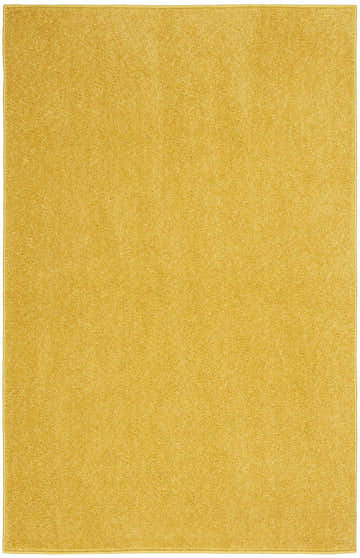 Close-up of a solid yellow Nourison Essentials Outdoor Area Rug. The rug has a low pile and a subtle texture.