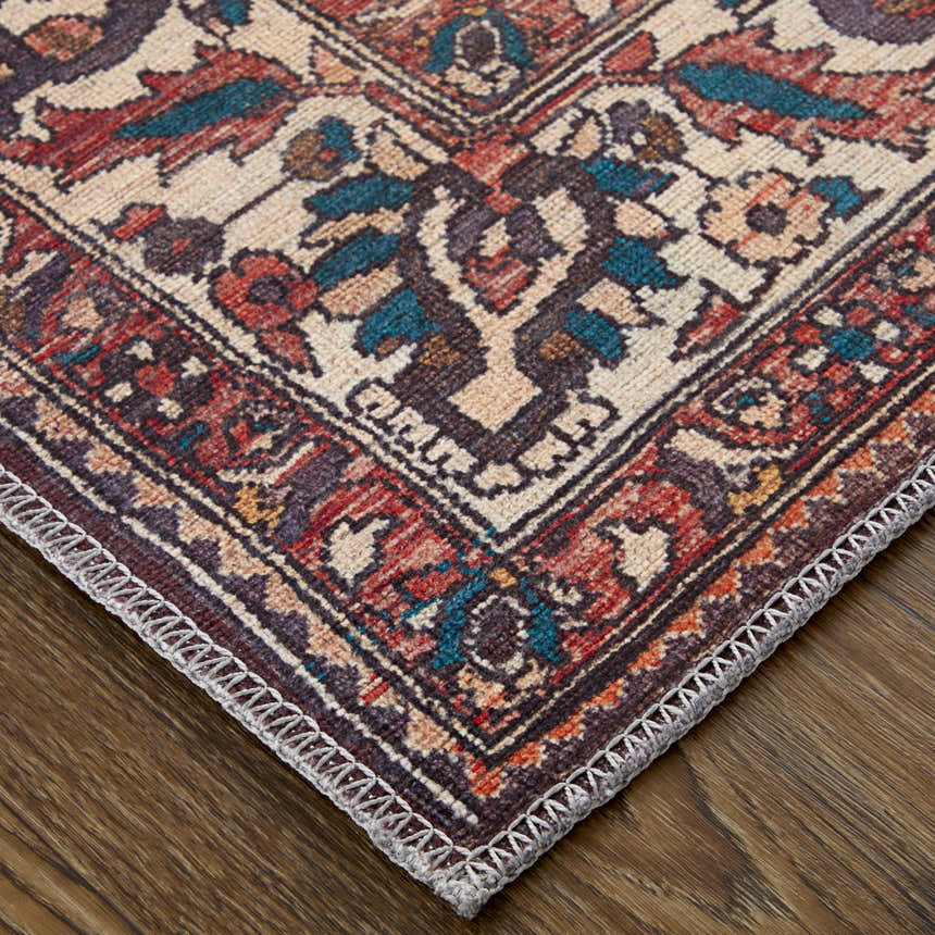 Close-up of Feizy Rawlins rug. Transitional oriental design in brown, red, ivory with a detailed border. Corner