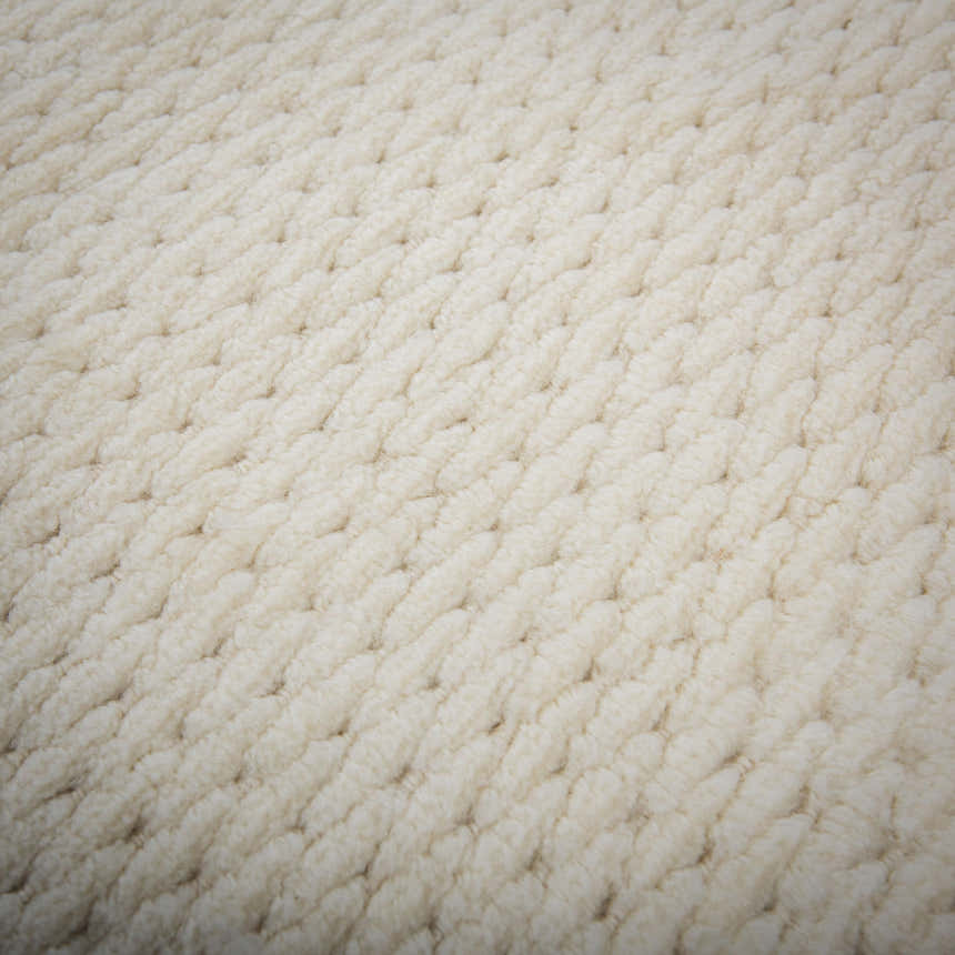 Close-up of the ivory Rizzy CLD707 rug. The hand-loomed wool rug has a chunky, textured, tone-on-tone solid design. Texture